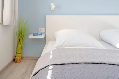 Ein Bett oder Betten in einem Zimmer der Unterkunft Landhaus Pönitz am See Wohnung 7