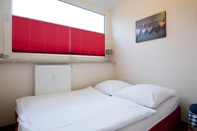 Ein Bett oder Betten in einem Zimmer der Unterkunft Erste Reihe