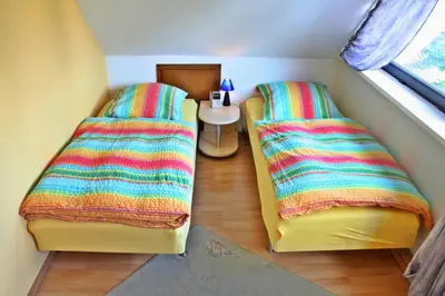 Ein Bett oder Betten in einem Zimmer der Unterkunft HAUS ACHTERDECK