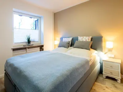 Ein Bett oder Betten in einem Zimmer der Unterkunft Strandliebe