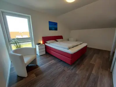Ein Bett oder Betten in einem Zimmer der Unterkunft Neue Liebe Haffkrug 5 - Meeresstern