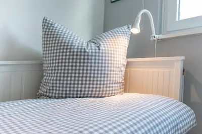 Ein Bett oder Betten in einem Zimmer der Unterkunft Ferienhaus Kleeblatt 5 - Zentrale, ruhige Lage mit Garten und Terrasse