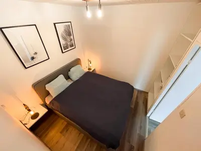 Ein Bett oder Betten in einem Zimmer der Unterkunft FeWo mit Meerblick am Hansapark