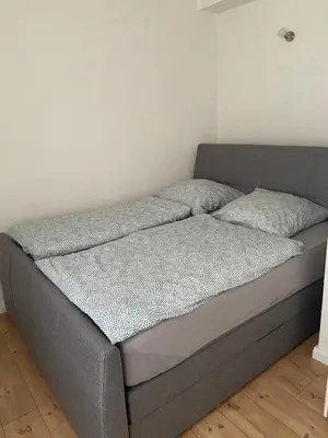 Ein Bett oder Betten in einem Zimmer der Unterkunft Ferienwohnungen Dummersdorfer Straße