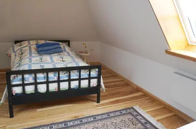 Ein Bett oder Betten in einem Zimmer der Unterkunft Gästehaus Kibbel
