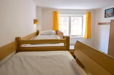 Ein Bett oder Betten in einem Zimmer der Unterkunft Jugendherberge Lübeck Altstadt