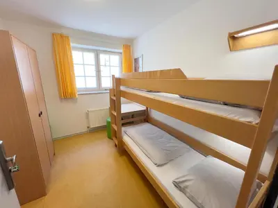 Ein Bett oder Betten in einem Zimmer der Unterkunft Jugendherberge Lübeck Altstadt