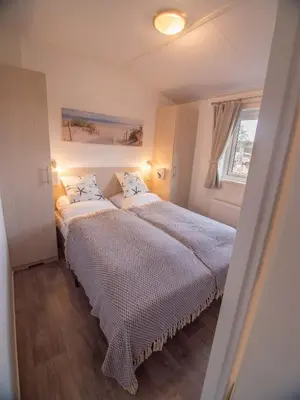 Ein Bett oder Betten in einem Zimmer der Unterkunft Strand 4
