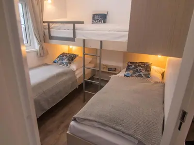 Ein Bett oder Betten in einem Zimmer der Unterkunft Strand 4