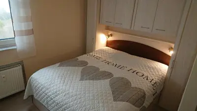 Ein Bett oder Betten in einem Zimmer der Unterkunft Traumhafte Meeresblick FeWo