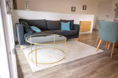 Ein Sitzbereich in der Unterkunft Ferienwohnung Sea Breeze Scharbeutz bietet Platz für bis zu 6 Personen in zentraler Lage von Scharbeutz