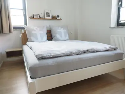 Ein Bett oder Betten in einem Zimmer der Unterkunft Timmenstrand
