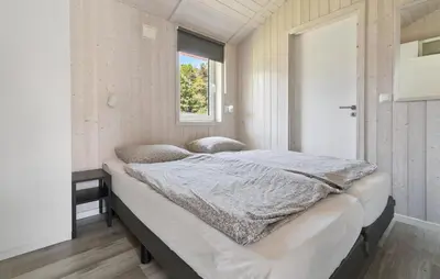 Ein Bett oder Betten in einem Zimmer der Unterkunft Dünenpark 2B - Dorf 4