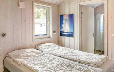 Ein Bett oder Betten in einem Zimmer der Unterkunft Dünenpark 2C - Dorf 4