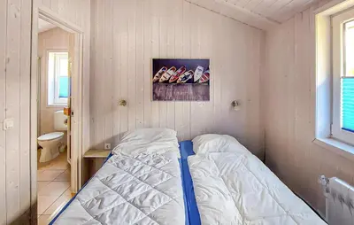Ein Bett oder Betten in einem Zimmer der Unterkunft Dünenpark 2C - Dorf 4