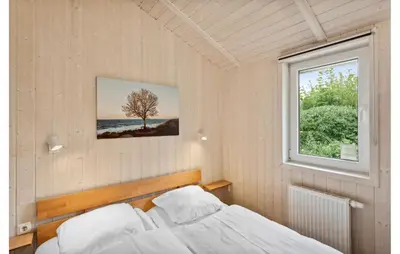 Ein Bett oder Betten in einem Zimmer der Unterkunft Dünenpark 2D - Dorf 4