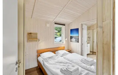 Ein Bett oder Betten in einem Zimmer der Unterkunft Dünenpark 2D - Dorf 4