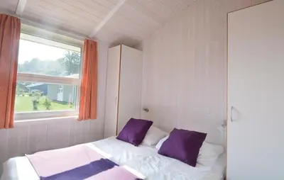 Ein Bett oder Betten in einem Zimmer der Unterkunft Dünenpark 15 - Dorf 6