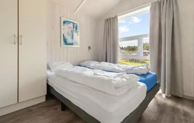 Ein Bett oder Betten in einem Zimmer der Unterkunft Freibeuterweg 8 - Dorf 6