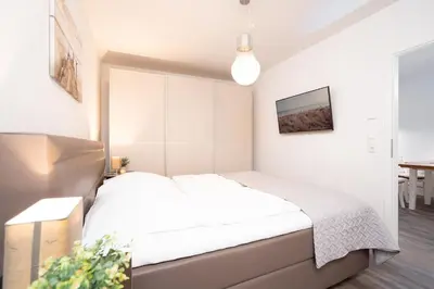 Ein Bett oder Betten in einem Zimmer der Unterkunft Strandvilla Augustusbad Wohnung 1