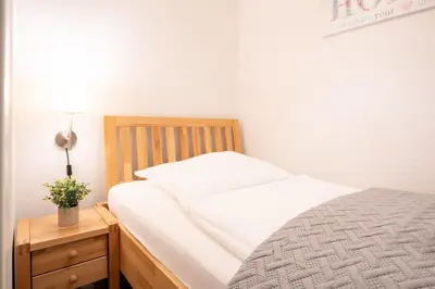Ein Bett oder Betten in einem Zimmer der Unterkunft Strandvilla Augustusbad Wohnung 1