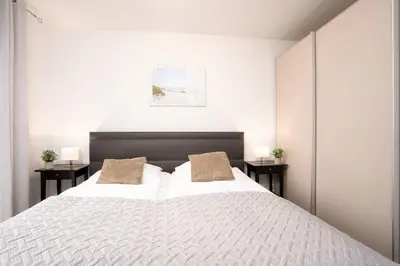 Ein Bett oder Betten in einem Zimmer der Unterkunft Strandvilla Augustusbad Wohnung 10