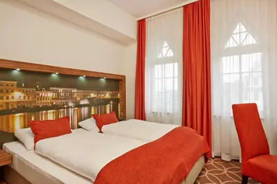 Ein Bett oder Betten in einem Zimmer der Unterkunft H+ Hotel Lübeck