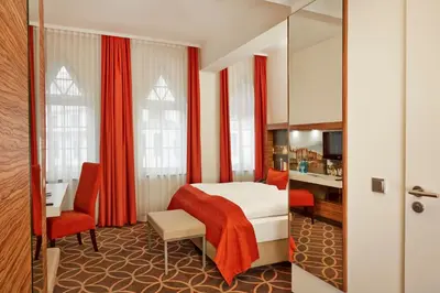 Ein Bett oder Betten in einem Zimmer der Unterkunft H+ Hotel Lübeck