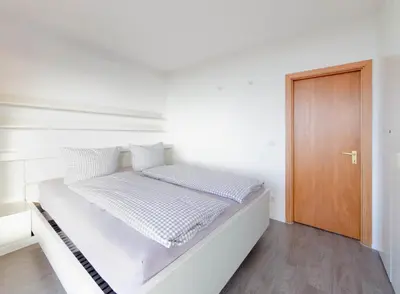 Ein Bett oder Betten in einem Zimmer der Unterkunft Residenz App 373 - Timmendorfer Strand