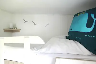 Ein Bett oder Betten in einem Zimmer der Unterkunft Ferienhaus 
