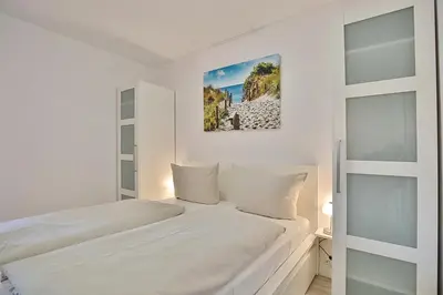 Ein Bett oder Betten in einem Zimmer der Unterkunft Strandresidenz Timmendorfer Strand Strandresidenz Appartement 108