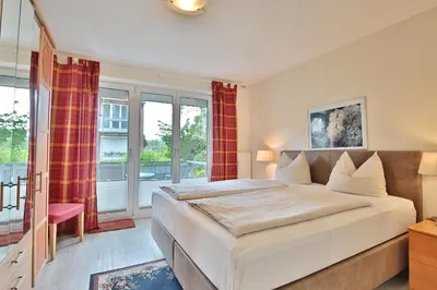 Ein Bett oder Betten in einem Zimmer der Unterkunft Strandduene Stranddüne Appartement 4