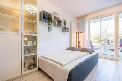 Ein Bett oder Betten in einem Zimmer der Unterkunft Ferienanlage Bergstraße 62 Ferienhaus Bergstraße 62 Appartement 8 Meeres Brise