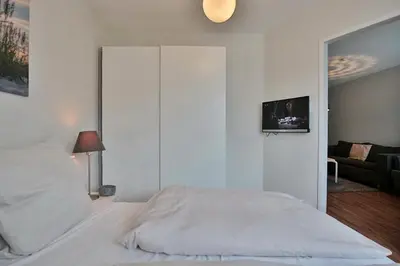 Ein Bett oder Betten in einem Zimmer der Unterkunft Strandhotel - Niendorf Strandhotel Niendorf Appartement 32