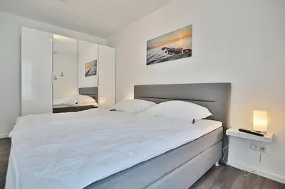 Ein Bett oder Betten in einem Zimmer der Unterkunft Ferienhaus Pommernweg Ferienwohnung Oeynhausen Appartement 3