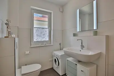 Ein Badezimmer in der Unterkunft Ferienhaus Pommernweg Ferienwohnung Oeynhausen Appartement 3