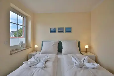 Ein Bett oder Betten in einem Zimmer der Unterkunft Gorch-Fock-Park Haus 02 Gorch-Fock-Park 2 Appartement 15