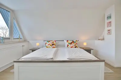 Ein Bett oder Betten in einem Zimmer der Unterkunft Haus Wiesenweg Haus Wiesenweg Appartement 7