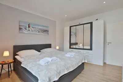 Ein Bett oder Betten in einem Zimmer der Unterkunft Res Herrenbruchstraße 7 Ferienwohnung Strandgut Appartement 1