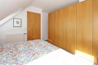 Ein Bett oder Betten in einem Zimmer der Unterkunft Haus Parkblick, Timmendorfer Strand Haus Parkblick Appartement 09