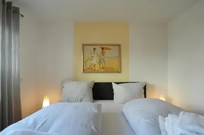Ein Bett oder Betten in einem Zimmer der Unterkunft Bädervilla am Höppnerweg Bädervilla am Höppnerweg Appartement 03