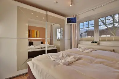 Ein Bett oder Betten in einem Zimmer der Unterkunft Bädervilla am Höppnerweg Bädervilla am Höppnerweg Appartement 05
