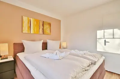 Ein Bett oder Betten in einem Zimmer der Unterkunft Bädervilla am Höppnerweg Bädervilla am Höppnerweg Appartement 05