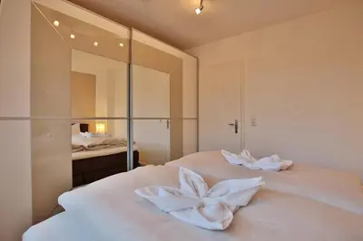 Ein Bett oder Betten in einem Zimmer der Unterkunft Bädervilla am Höppnerweg Bädervilla am Höppnerweg Appartement 06
