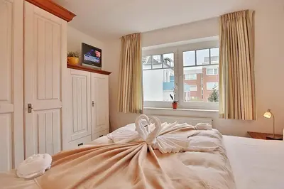 Ein Bett oder Betten in einem Zimmer der Unterkunft Bädervilla am Höppnerweg Bädervilla am Höppnerweg Appartement 07