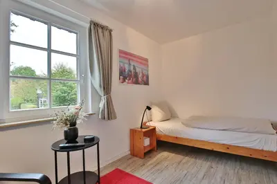 Ein Bett oder Betten in einem Zimmer der Unterkunft Am Rosenhain 6 Am Rosenhain 6 Appartement 4