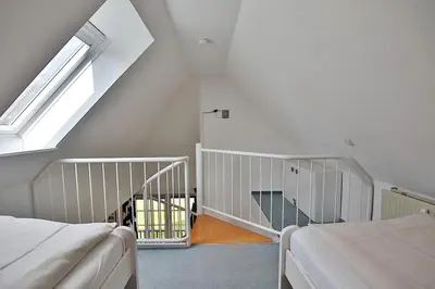 Ein Bett oder Betten in einem Zimmer der Unterkunft Am Rosenhain 9 Am Rosenhain 9 Appartement 4