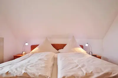 Ein Bett oder Betten in einem Zimmer der Unterkunft Am Rosenhain 9 Am Rosenhain 9 Appartement 4