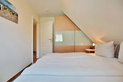 Ein Bett oder Betten in einem Zimmer der Unterkunft Sunshine-Residenz Sunshine Residenz Appartement 5