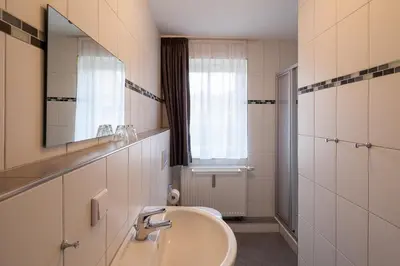 Ein Badezimmer in der Unterkunft Am Rosenhain 6 Am Rosenhain 6 Appartement 1
